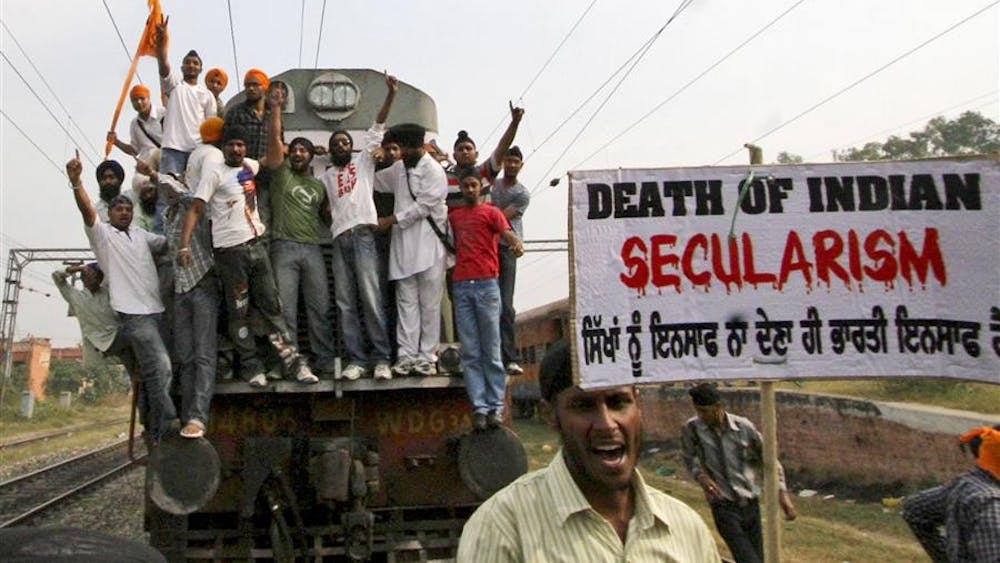 Sikh activists stop a train during a protest to mark the 25th anniversary of the 1984 riots against Sikhs on Tuesday in Jalandhar, India. 2,000 people were killed in the 1984 anti-Sikh riots after the murder of then-prime minister Indira Gandhi by her two Sikh bodyguards. 