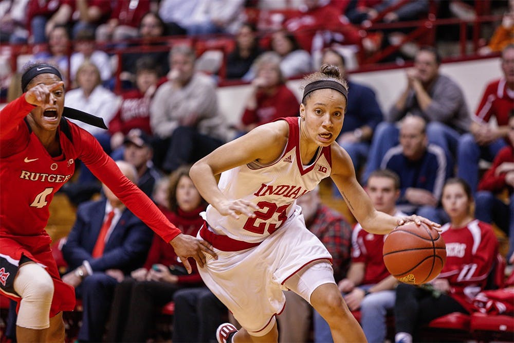 Junior guard Alexis Gassion pushes the ball up the court against Rutgers. IU defeated Rutgers 64-48 on Wedensday to improve their home record to 9-0. 