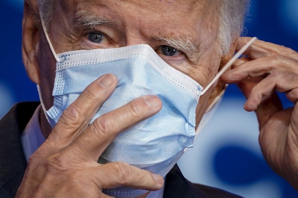 President-elect Joe Biden puts on his face mask Oct. 28 after making remarks about the Affordable Care Act and COVID-19 in Wilmington, Delaware. Biden was named president-elect Saturday. 