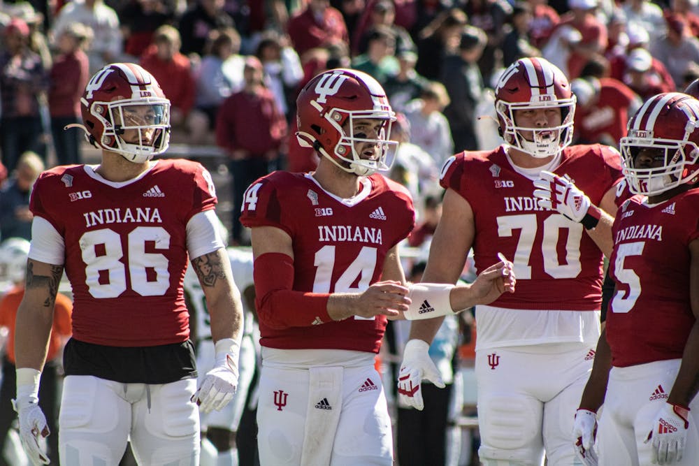 Junior quaterback Jack Tuttle gathers the offense against Michigan State on Oct. 16, 2021, at Memorial Stadium. Indiana football has scored one touchdown in three Big Ten games this season.