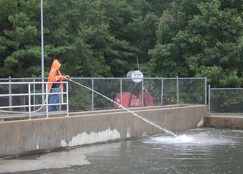 <p>A worker sprays water into the basins of the Monroe Water Treatment Plant to break up sediment that collects at the top. The City of Bloomington issued a press release <a href="https://bloomington.in.gov/news/2023/06/05/5640" target="_blank"></a>June 5, 2023, acknowledging a failure to report samples of April’s total organic carbon in the city’s drinking water due to an error in shipping. </p>