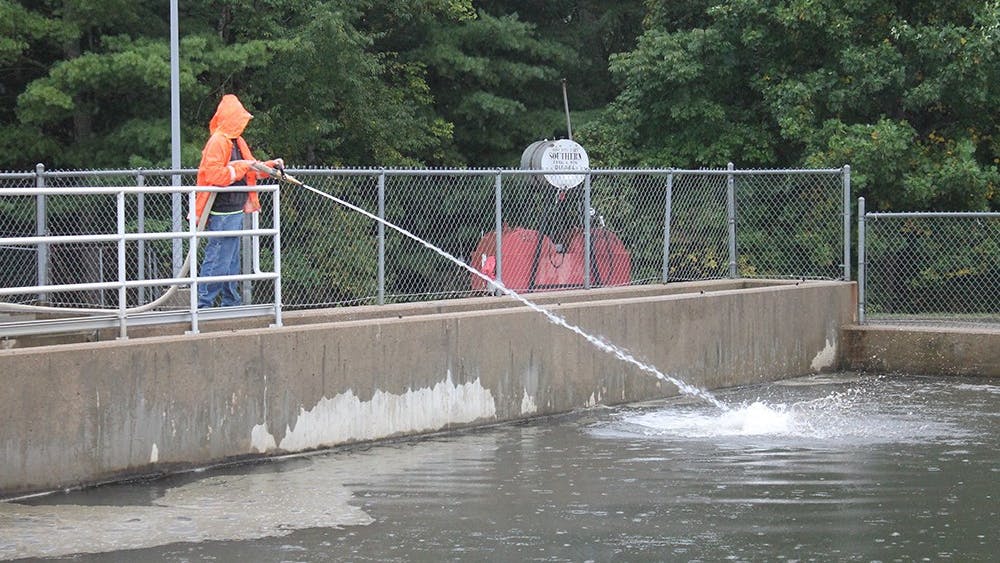 A worker sprays water into the basins of the Monroe Water Treatment Plant to break up sediment that collects at the top. The City of Bloomington issued a press release June 5, 2023, acknowledging a failure to report samples of April’s total organic carbon in the city’s drinking water due to an error in shipping. 