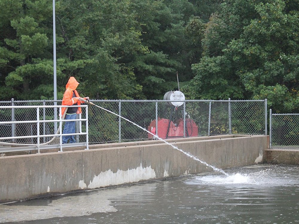 A worker sprays water into the basins of the Monroe Water Treatment Plant to break up sediment that collects at the top. The City of Bloomington issued a press release June 5, 2023, acknowledging a failure to report samples of April’s total organic carbon in the city’s drinking water due to an error in shipping. 