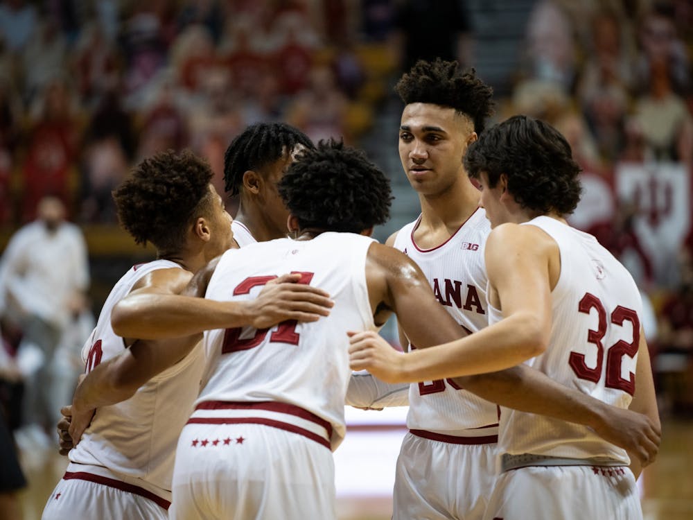 The IU men&#x27;s basketball team huddles Jan. 14 at Simon Skjodt Assembly Hall. The Hoosiers will play 11 non-conference games this season, including nine games at home. 