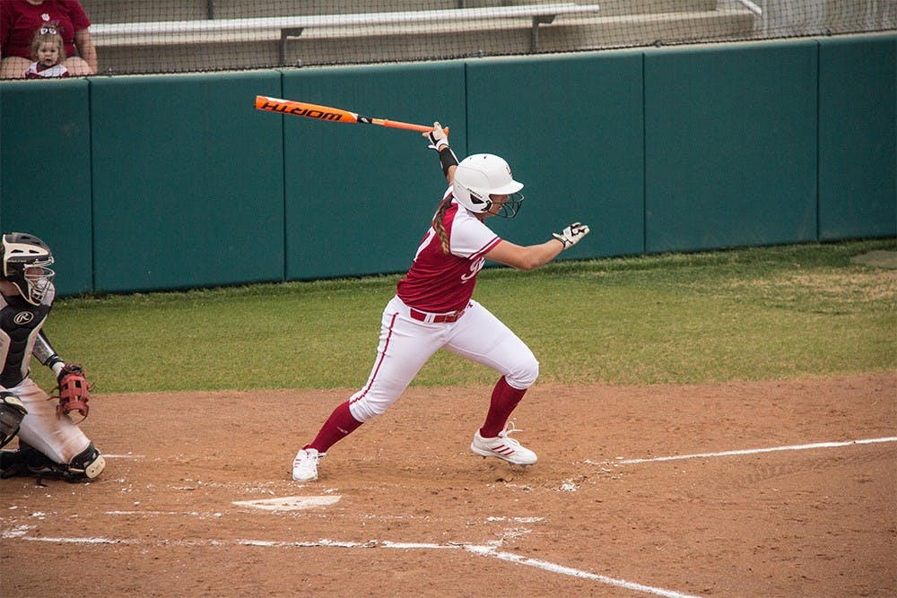 Senior Katelyn Conenna swings at a pitch Wednesday at Andy Mohr Field. IU won against the Ball State 7-1. 