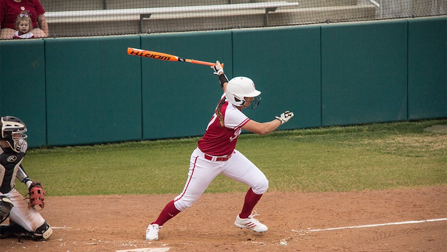 Senior Katelyn Conenna swings at a pitch Wednesday at Andy Mohr Field. IU won against the Ball State 7-1. 