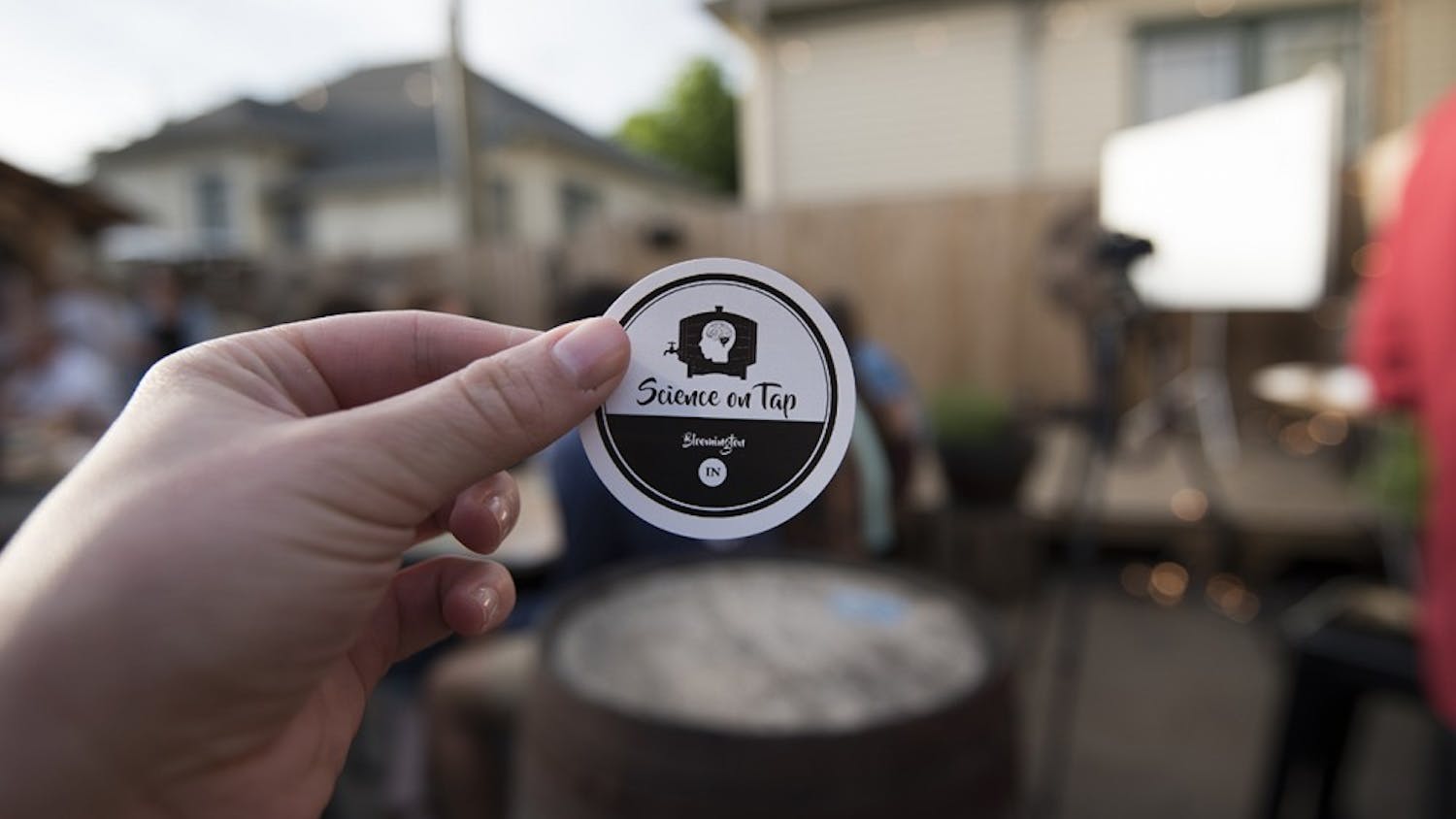 Sean Buehler handed out stickers for Science on Tap on Tuesday night. This was the last event for the year.