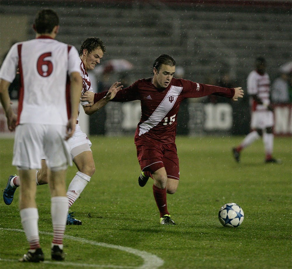 Freshman defender Andrew Gutman blocks a Wisconsin player from taking the ball from him. The Hoosiers battled the rain and the Badgers on Oct. 31 to secure a 1-0 victory. 