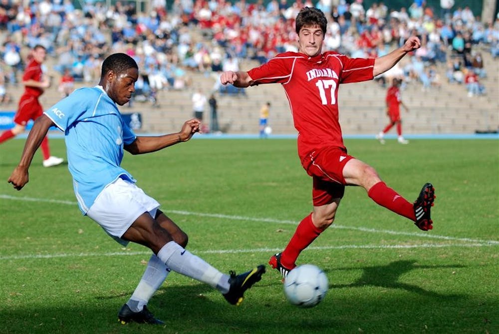 North Carolina's Alex Dixon kicks past senior midfielder Lee Hagedorn during the third round of the NCAA Men's Soccer Championship on Sunday in Chapel Hill, N.C. The Hoosiers fell to the fifth-seeded Tar Heels 1-0.