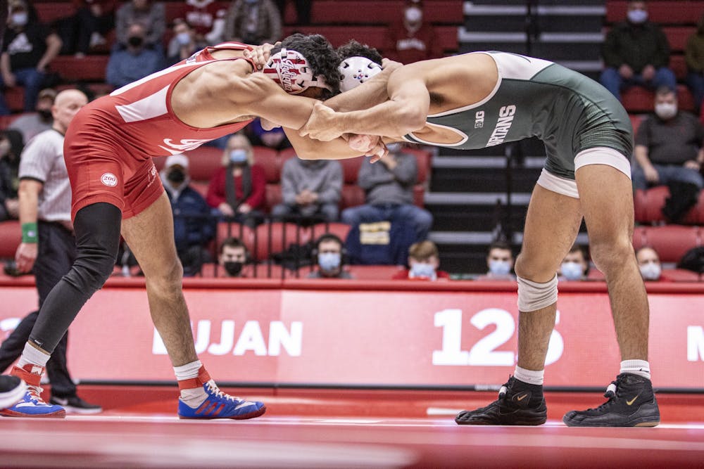 <p>Indiana Sophomore Jacob Moran wrestles against Michigan State Freshman Tristan Lujan on Jan. 17, 2022, at Wilkinson Hall. Indiana lost to University of Chattanooga 15-21 on Feb. 20, 2022, at Wilkinson Hall. </p>