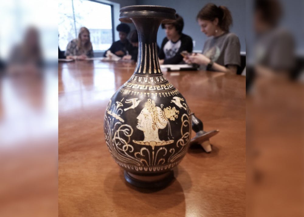 <p>A student-curated piece created with a head of a woman decorated with doves and flowers is pictured. The &quot;Life and Legend: Storytelling and Greek Pottery&quot; exhibit opens May 4, 2023.<br/><br/></p>
