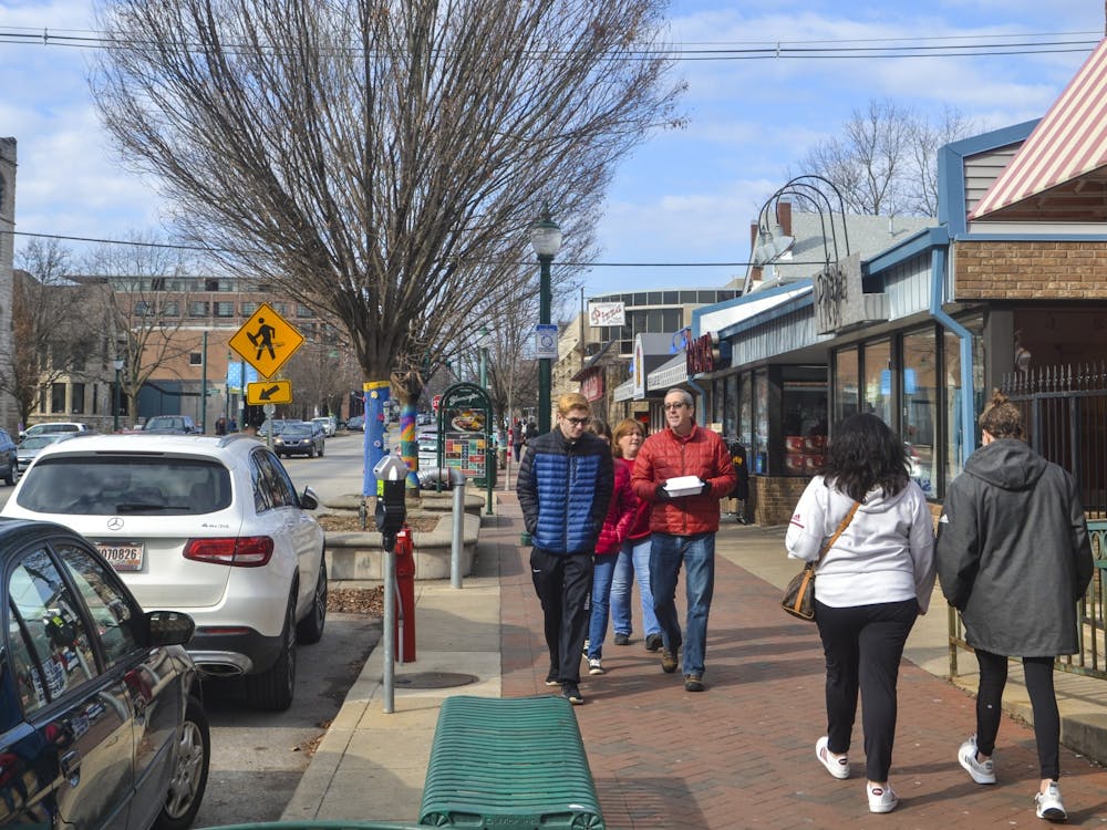 Bloomington community members walk Feb. 16, 2020, along Kirkwood Avenue. As the weather continues to cool down, Indiana residents should begin preparing for a heavy winter.
