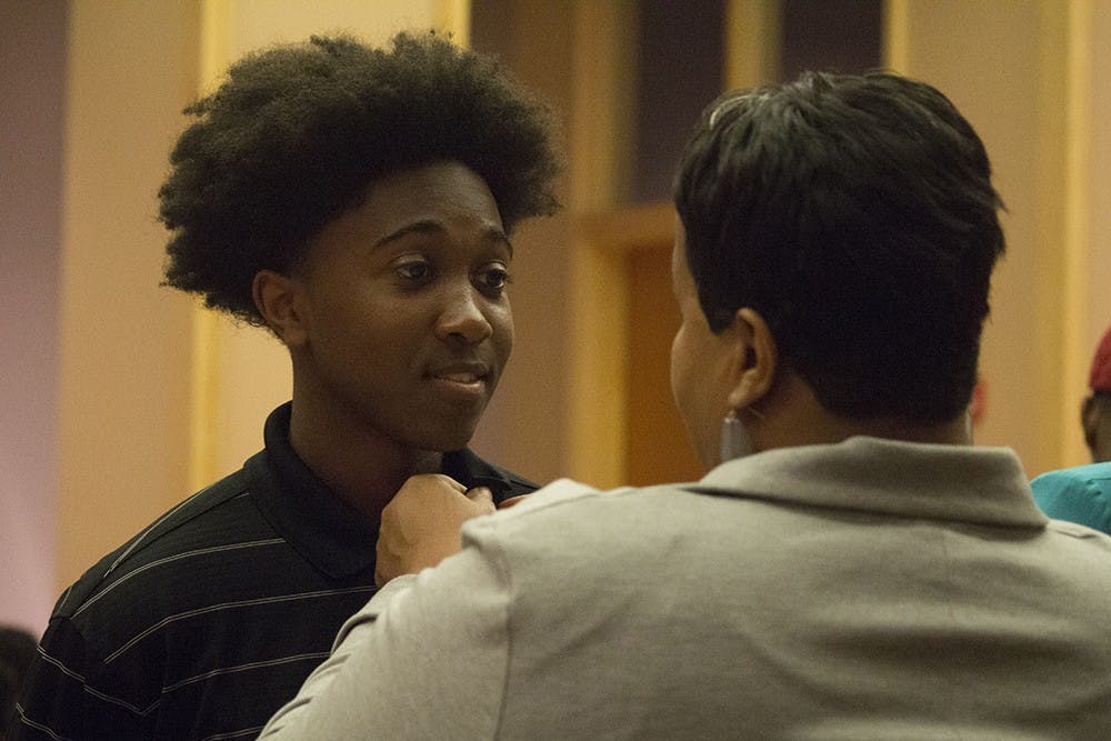 Gregory Wilson receives his pin during the Black Freshman Pinning Ceremony on Thursday at the Neal-Marshall Black Culture Center. 