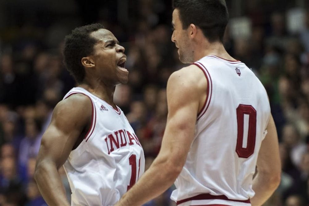 Sophomore Kevin "Yogi" Ferrell celebrates with senior Will Sheehey after Sheehey hit a three-pointer late in IU's game against Northwestern on Saturday at Welsh-Ryan Arena. IU won 61-55.