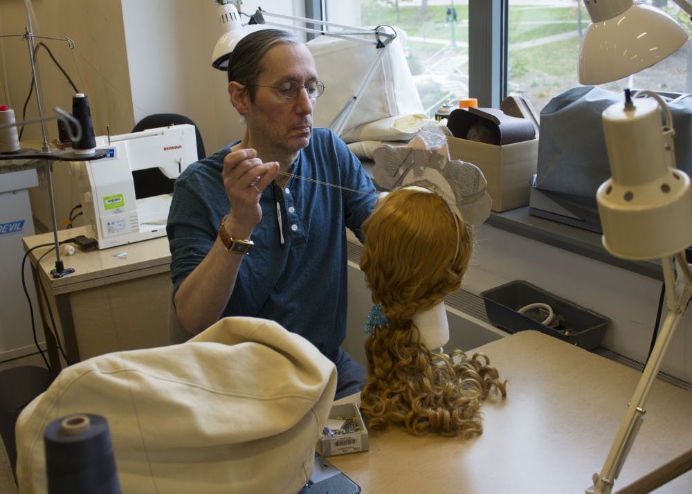 <p>Robbie Stanton, costume supervisor for the IU Department of Theatre, Drama, and Contemporary Dance, works on a headpiece for "Peter and the Starcatcher." The headpiece is part of a mermaid costume for the teacher's character.&nbsp;</p>