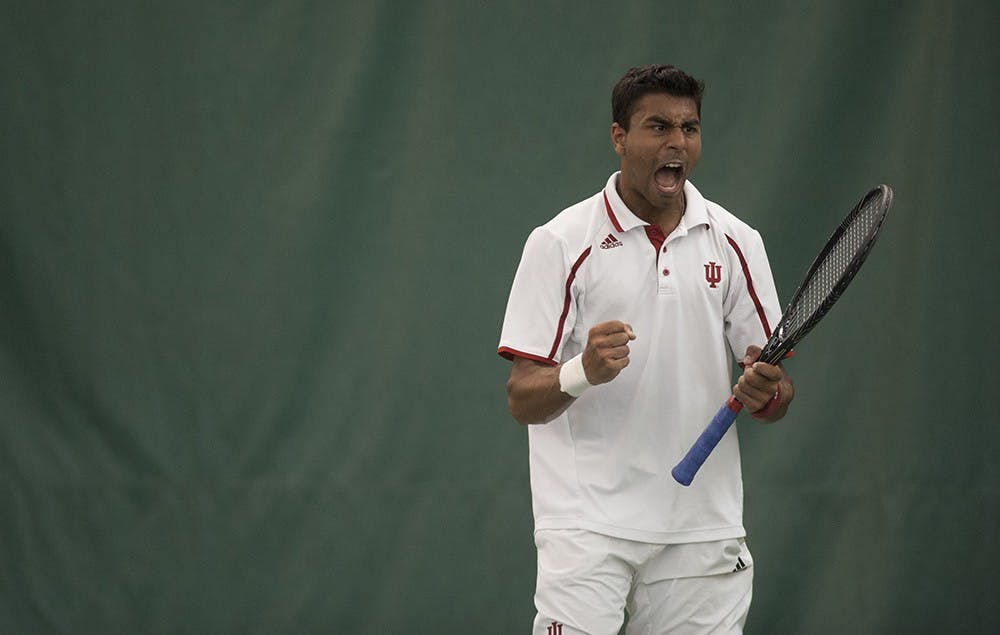 IU freshman Raheel Manji lets out a triumphant scream after scoring a point against John Mullane, a junior from Michigan State University, on Sunday at the IU Tennis Center. Manji won the match 6-4, 6-0.