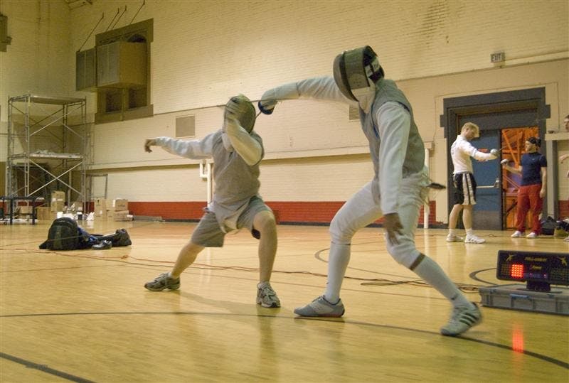 Fencing partners Ekram Hossain and Mark Conaway square off Feb. 24 outside the Fort in the Health, Physical Education and Recreation building. The club meets in HPER 293 on Tuesdays, Wednesdays and Thursdays from 6 to 8 p.m..
