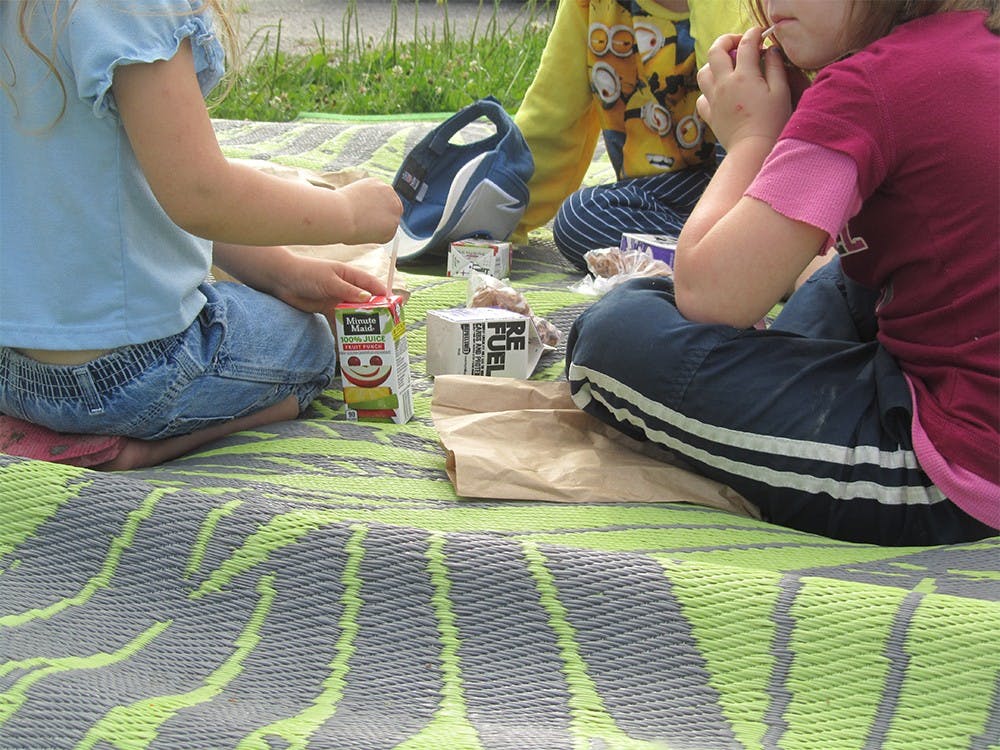 Children eat breakfast provided by the Community Kitchen of Monroe County. The organization's summer food program provides 300 meals a day to low-income children in the area. 