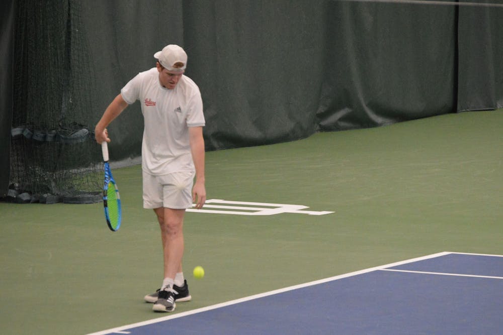 <p>Then-junior Patrick Fletchall prepares to serve the ball April 11, 2021, at the IU Tennis Center. Indiana’s season ended with a loss to Michigan in the Big Ten Tournament on Friday.</p>
