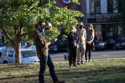 A man reads the mourner’s kaddish, a Jewish prayer, at a vigil for Justice Ruth Bader Ginsburg on Sept. 20 outside of the Monroe County Courthouse. The vigil included prayer, song and speeches from participants. 