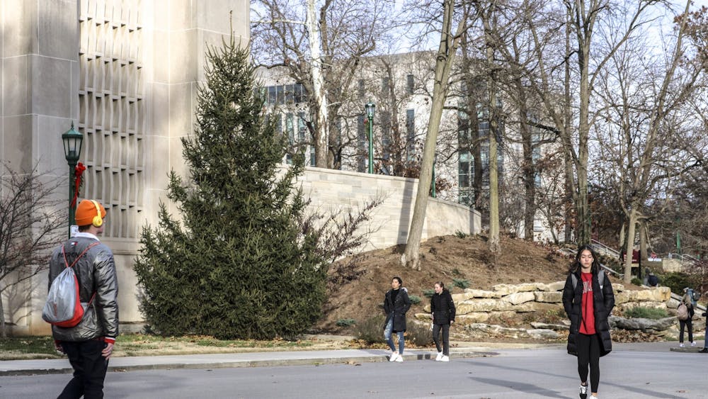 Students walk through campus Nov. 29, 2021, near the IU Auditorium.