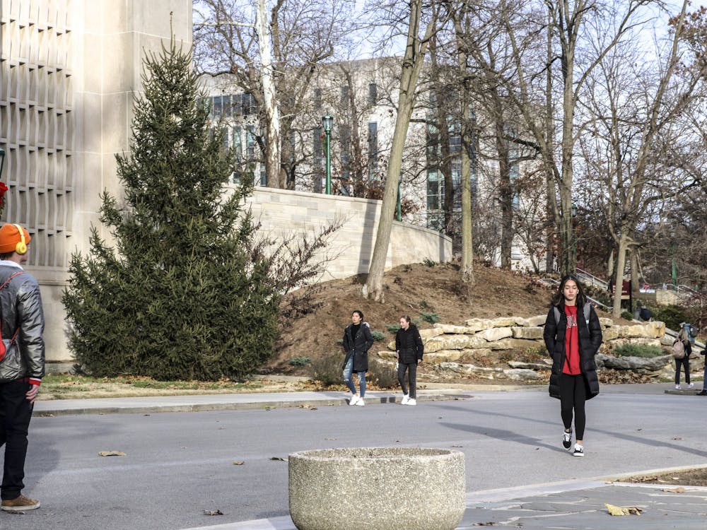 Students walk through campus Nov. 29, 2021, near the IU Auditorium.