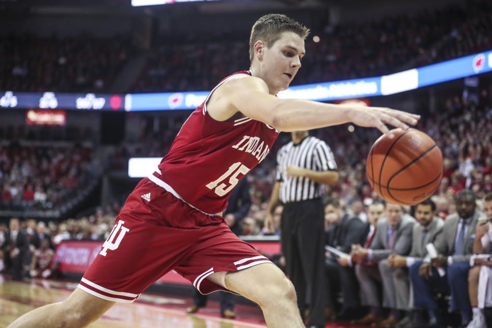 <p>Junior guard Zach McRoberts attempts to recover a failed pass during IU's game against the University of Wisconsin Badgers on Tuesday at the Kohl Center in Madison, Wisconsin. The Hoosiers lost 71-61.</p>