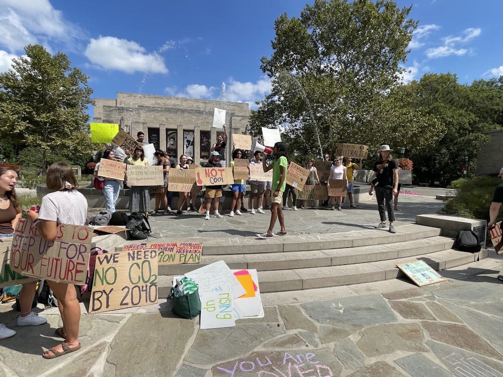 <p>Sidd Das, president of Students for a New Green World, addresses protestors outside of the IU Auditorium on Aug. 26. The demonstrators called for climate action from the university.</p>