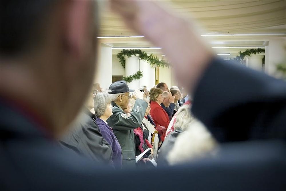 Armed service veterans salute the American flag during Veterans Day ceremonies Tuesday morning in the Monroe County Courhouse Rotunda.