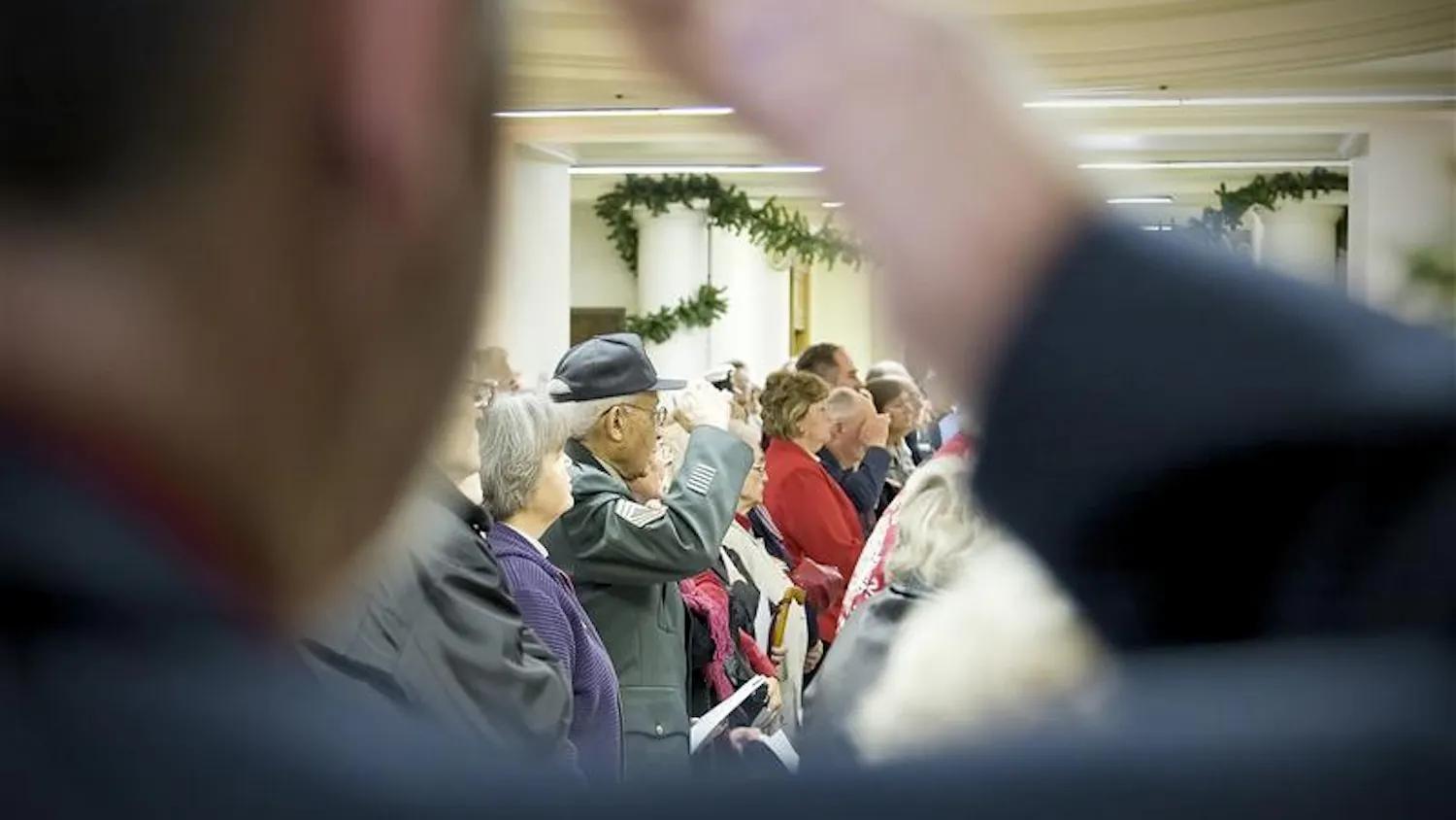 Armed service veterans salute the American flag during Veterans Day ceremonies Tuesday morning in the Monroe County Courhouse Rotunda.