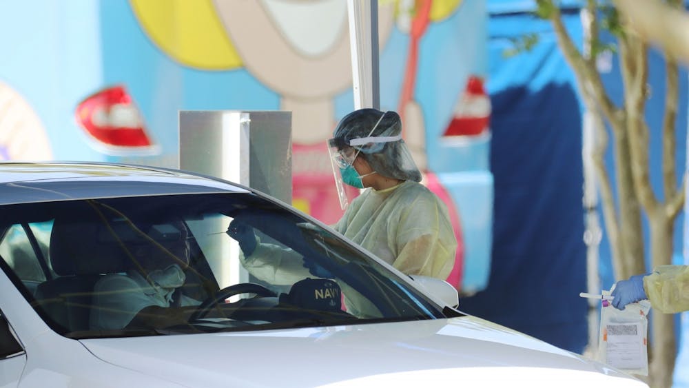 A car pulls up to a drive-thru coronavirus testing site April 21 in Orange County, Florida. Starting Saturday, the Richard M. Fairbanks School of Public Health at IU-Purdue University Indianapolis will begin tracking the spread of COVID-19 across  Indiana.