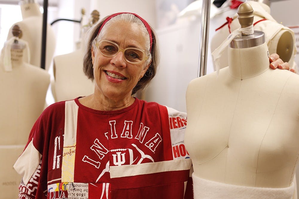 Professor Jane Matranga wears one of her designs created for The 6th Annual Trashion Refashion Runway Show.  The show will be held at the Buskirk-Chumley Theater on Sunday.