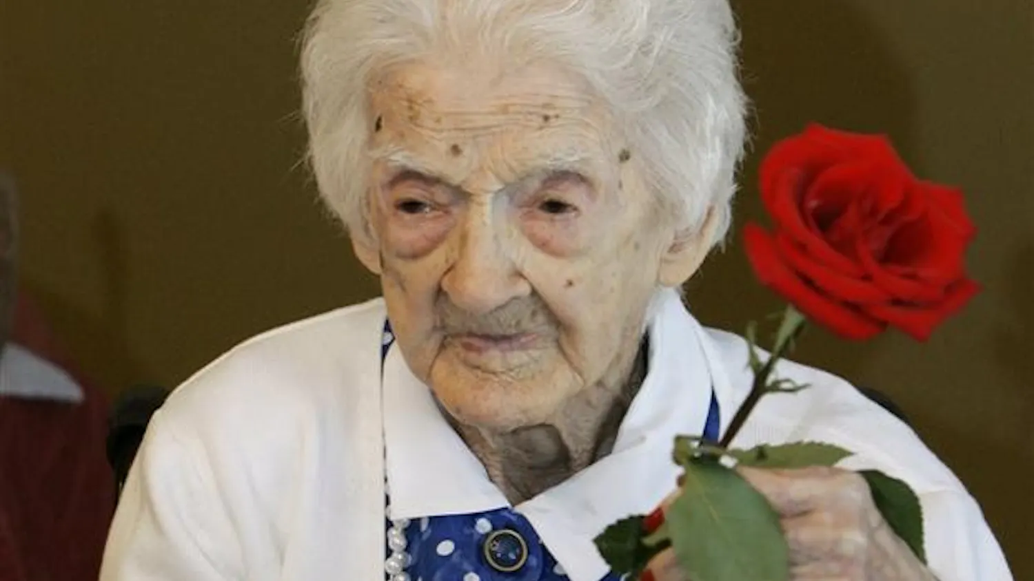 Edna Parker holds a rose that she was given during a birthday party for her in Shelbyville, Ind., in this Friday, April 18, 2008 file photo. Parker passed away Wednesday Nov. 26, 2008 at a nursing home in Shelbyville, Ind., UCLA gerontologist Dr. Stephen Coles said. Parker was born April 20, 1893 and was 115 years, 120 days old.