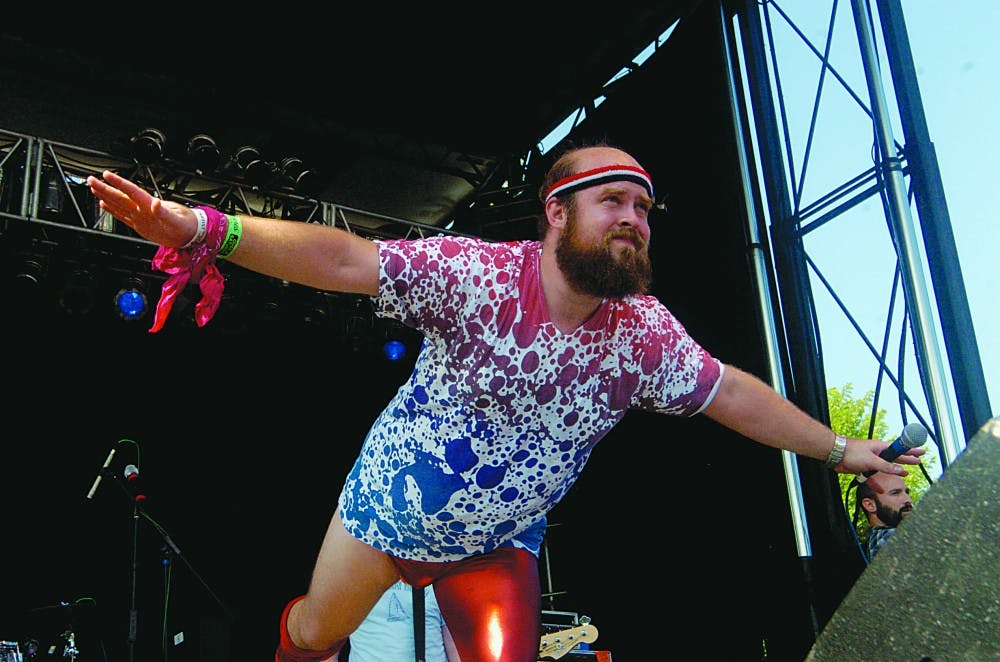 Les Savy Fav frontman Tim Harrington stripped his clothing and dove into the crowd during the band's set at Pitchfork on Saturday, July 18.