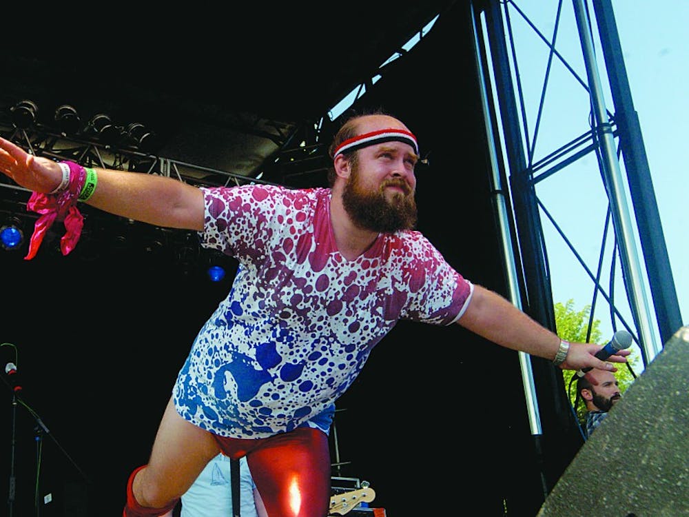 Les Savy Fav frontman Tim Harrington stripped his clothing and dove into the crowd during the band's set at Pitchfork on Saturday, July 18.