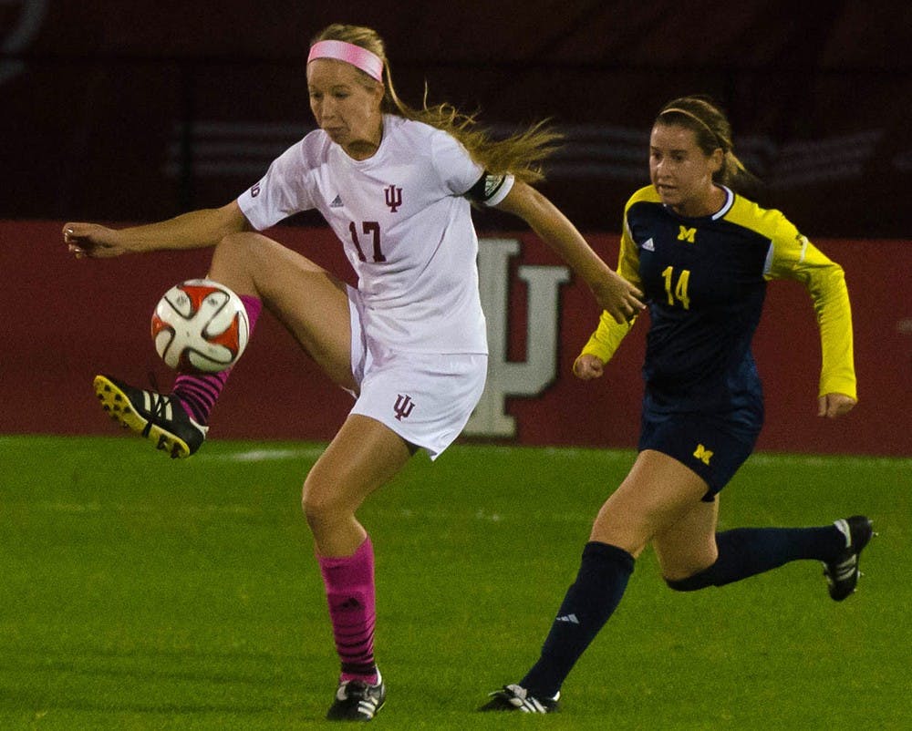 Senior midfielder Jordan Woolums intercepts a pass during IU's game against Michigan on Oct. 11 at Bill Armstrong Stadium. The wolverines defeated IU 3-0.