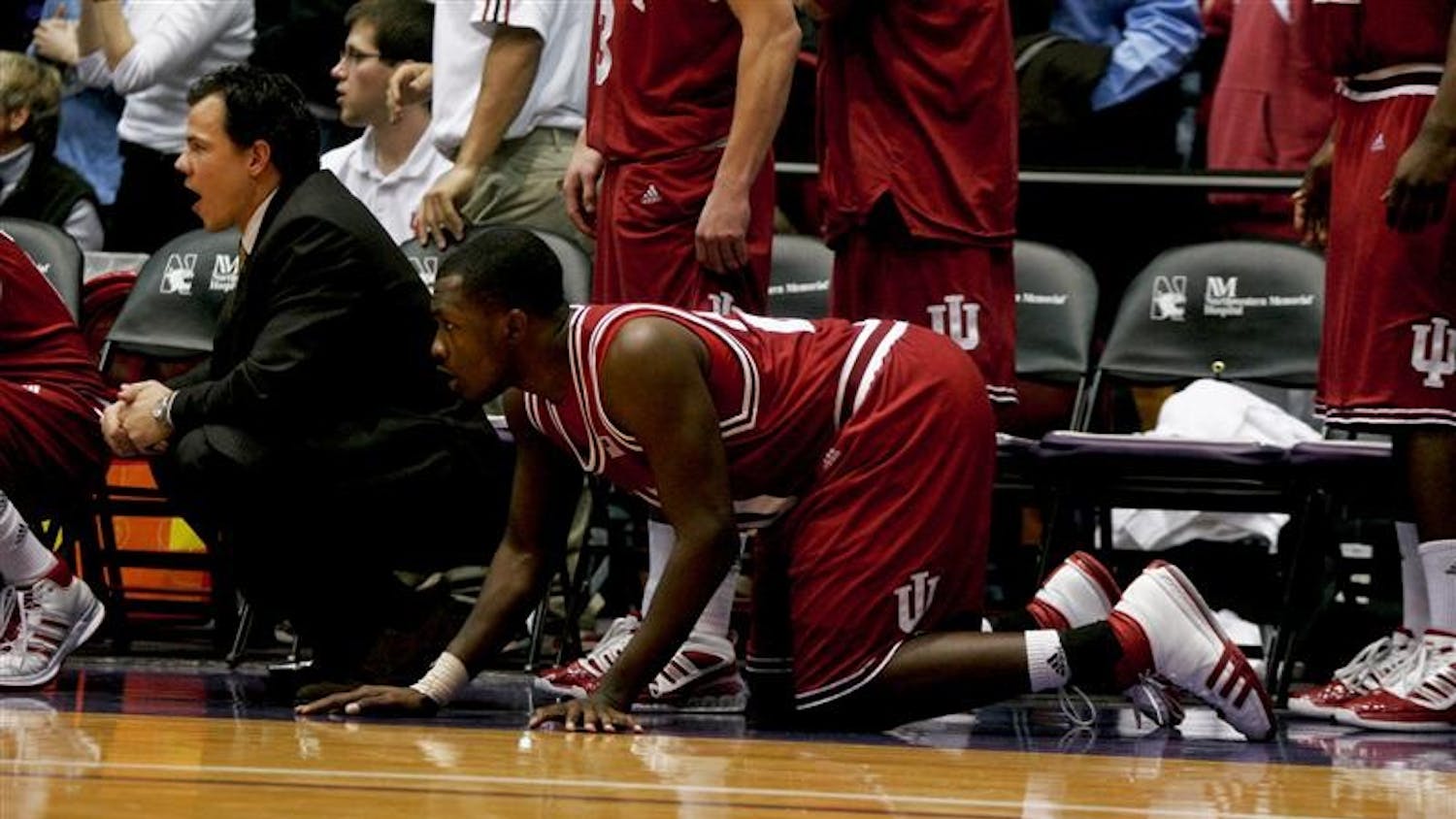 IU Strength and Conditioning Coach Jeff Watkinson and freshman guard/forward Malik Story react to a play during the final moments of the Hoosiers’ loss to the Northwestern Wildcats on Wednesday evening in Evanston, Ill.