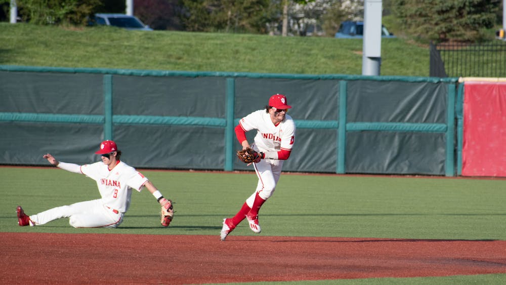 Indiana senior shortstop Philip Glasser throws to first April 28, 2023, against Maryland at Bart Kaufman Field in Bloomington.