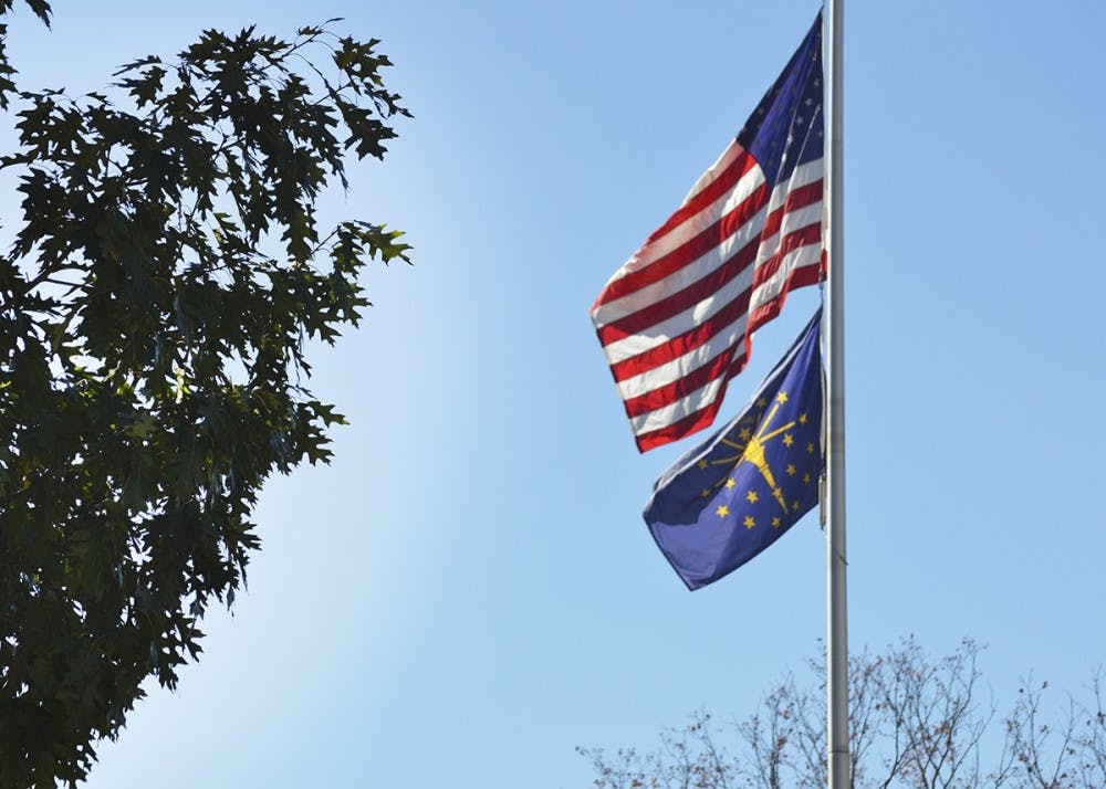 An American flag outside of Franklin Hall waves in the wind Tuesday.
