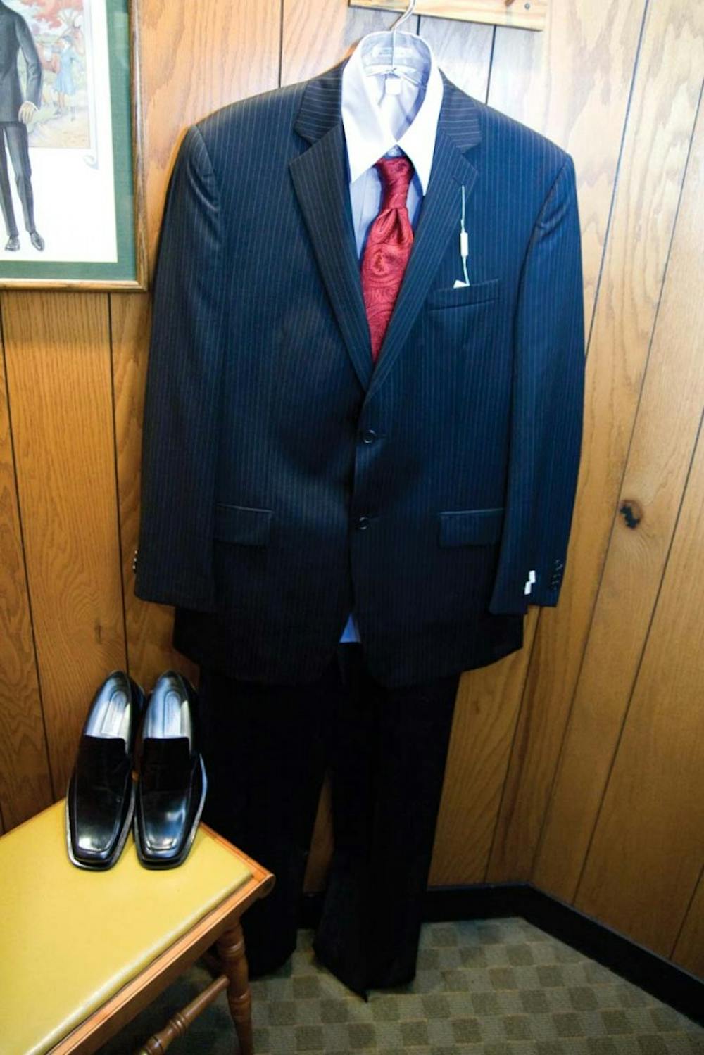 O'Sullivan's on 114 N. Washington St.
• Michael Kors striped suit-set: $295
• Countess Maria red patterned tie: $50
• Light blue Kenneth Cole button-up shirt: $59.50
• Kenneth Clue patent leather shoes: $165
TOTAL: $569.50