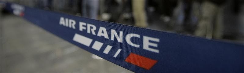 Reporters work in front of the Air France check-in desk of the Tom Jobim Airport in Rio de Janeiro, in Rio de Janeiro,Tuesday, June 2, 2009. Brazil's Air Force says it has found airplane seats and other debris floating in the Atlantic Ocean along the path that a missing Air France jet was flying.