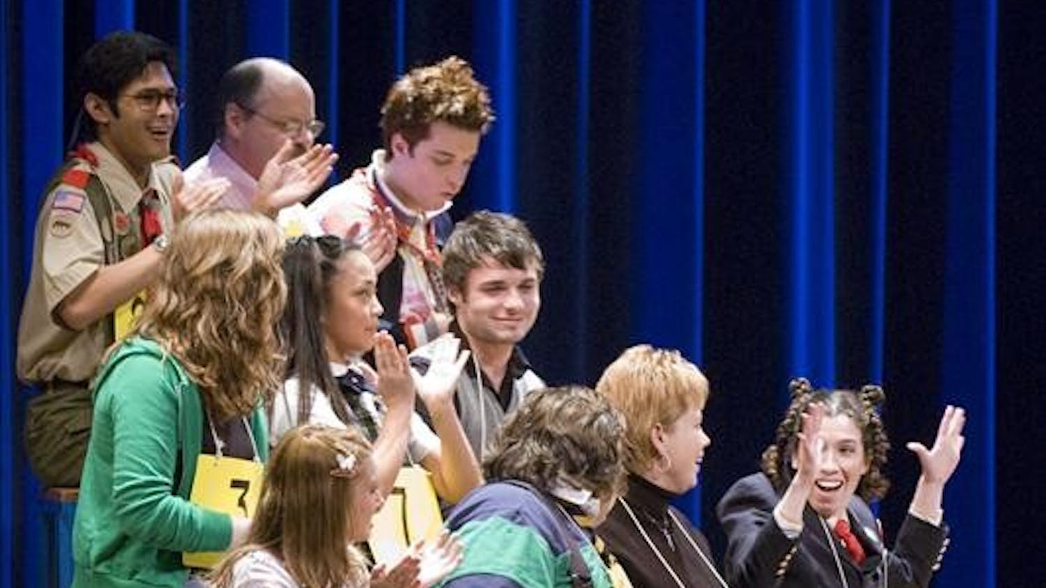 Spelling bee participants applaud the commencement of the spelling bee on Wednesday evening at IU Auditorium. This one-act Broadway musical is a Tony-Awward winning performance. 