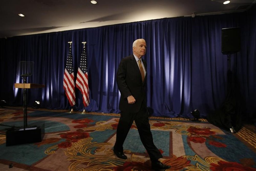 Republican presidential candidate Sen. John McCain, R-Ariz., leaves the podium after delivering a statement to the traveling press corps on Wednesday in New York that he is directing his staff to work with Barack Obama's campaign and the debate commission to delay Friday's debate because of the economic crisis.