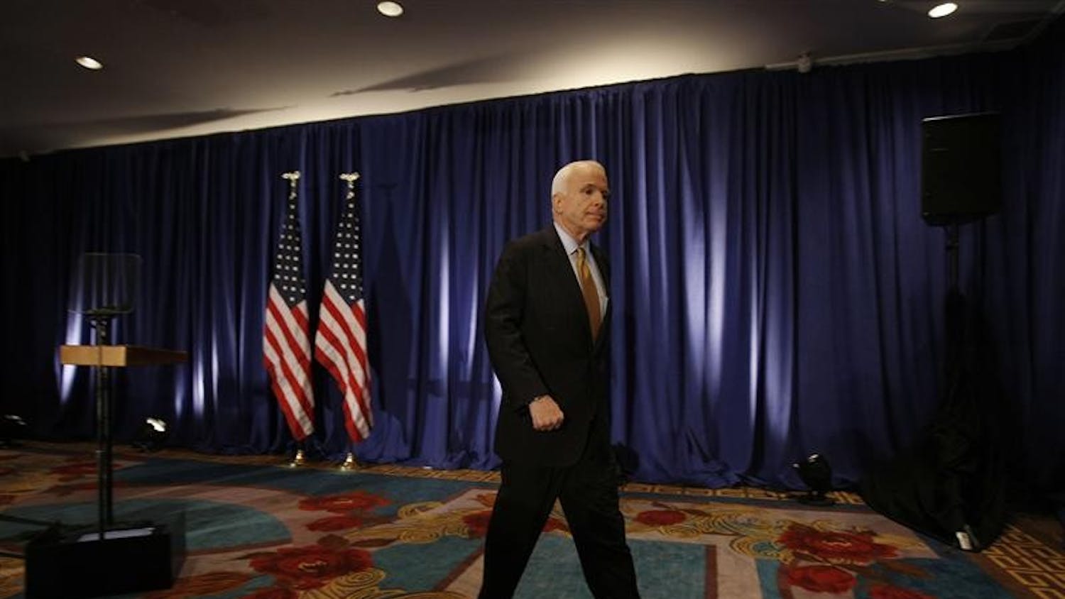 Republican presidential candidate Sen. John McCain, R-Ariz., leaves the podium after delivering a statement to the traveling press corps on Wednesday in New York that he is directing his staff to work with Barack Obama's campaign and the debate commission to delay Friday's debate because of the economic crisis.