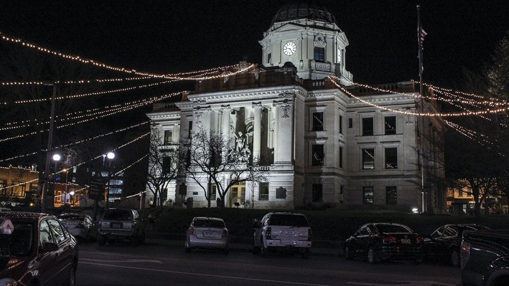 The square in downtown Bloomington is lit up with lights for the holiday season. The lights are hung from the top of the capital building onto the tops of the stores surrounding the square.&nbsp;