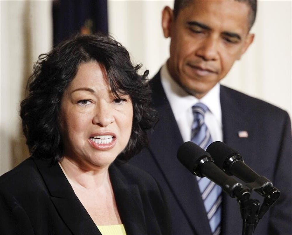 President Barack Obama looks on as his Supreme Court nominee Sonia Sotomayor speaks in the East Room of the White House in Washington, Tuesday May 26, 2009.