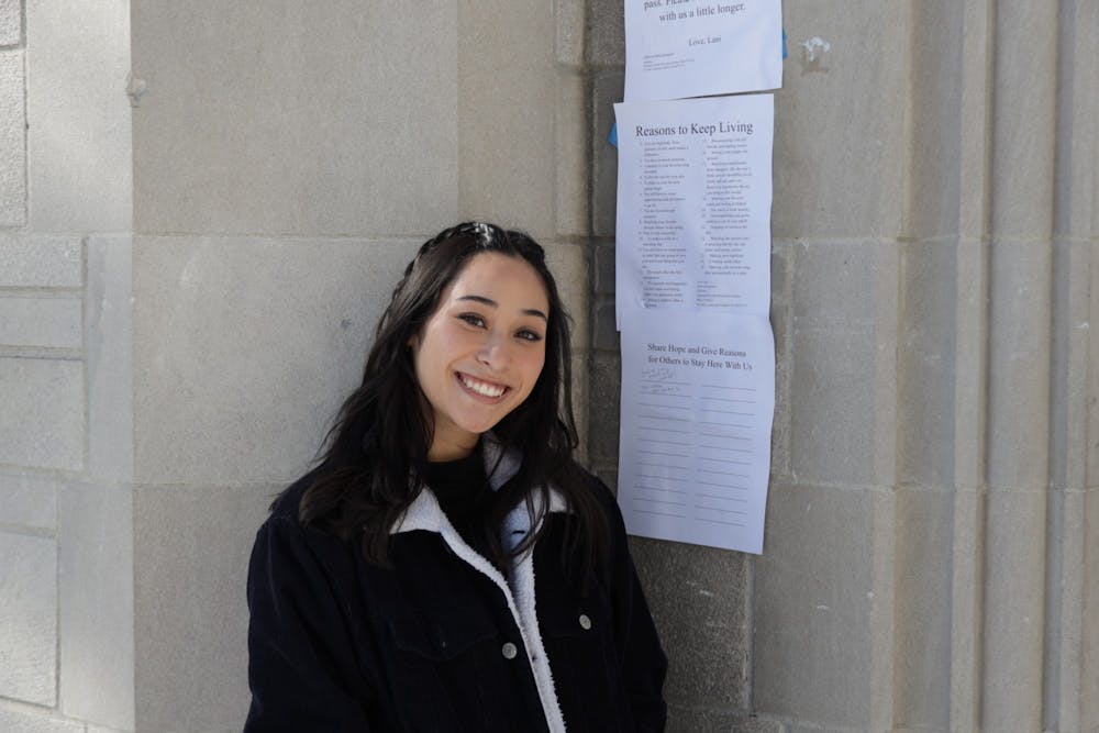 <p>Senior Noelani Edwards is pictured on Feb. 8, 2022, at the Sample Gates. Edwards has been leaving postive notes and reminders around campus. </p>