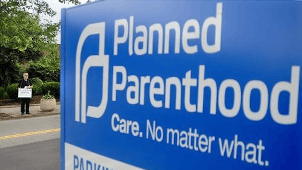 A Planned Parenthood clinic sign stands along a street. Planned Parenthood was instructed to suspend all volunteer activities March 18 amid the coronavirus pandemic.