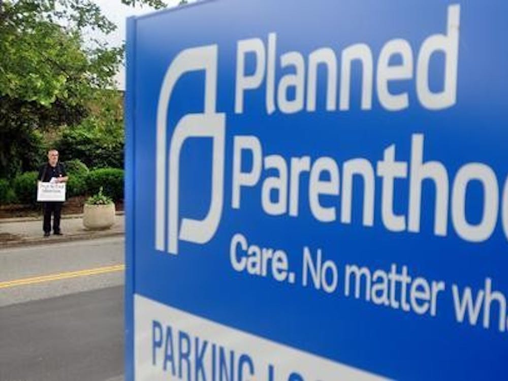 A Planned Parenthood clinic sign stands along a street. Planned Parenthood was instructed to suspend all volunteer activities March 18 amid the coronavirus pandemic.