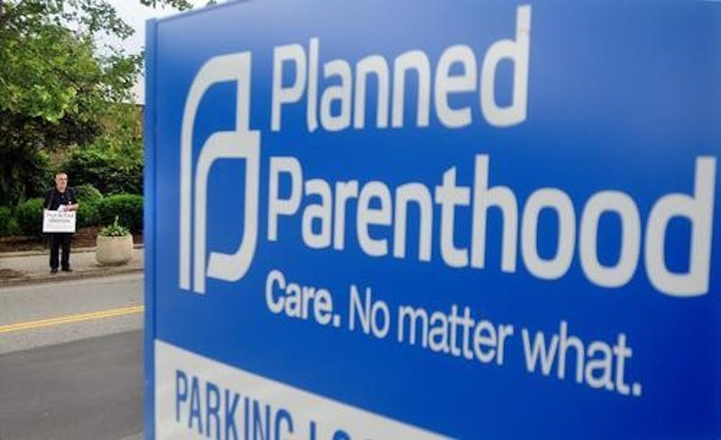 A Planned Parenthood clinic sign stands along a street. Planned Parenthood was instructed to suspend all volunteer activities March 18 amid the coronavirus pandemic.